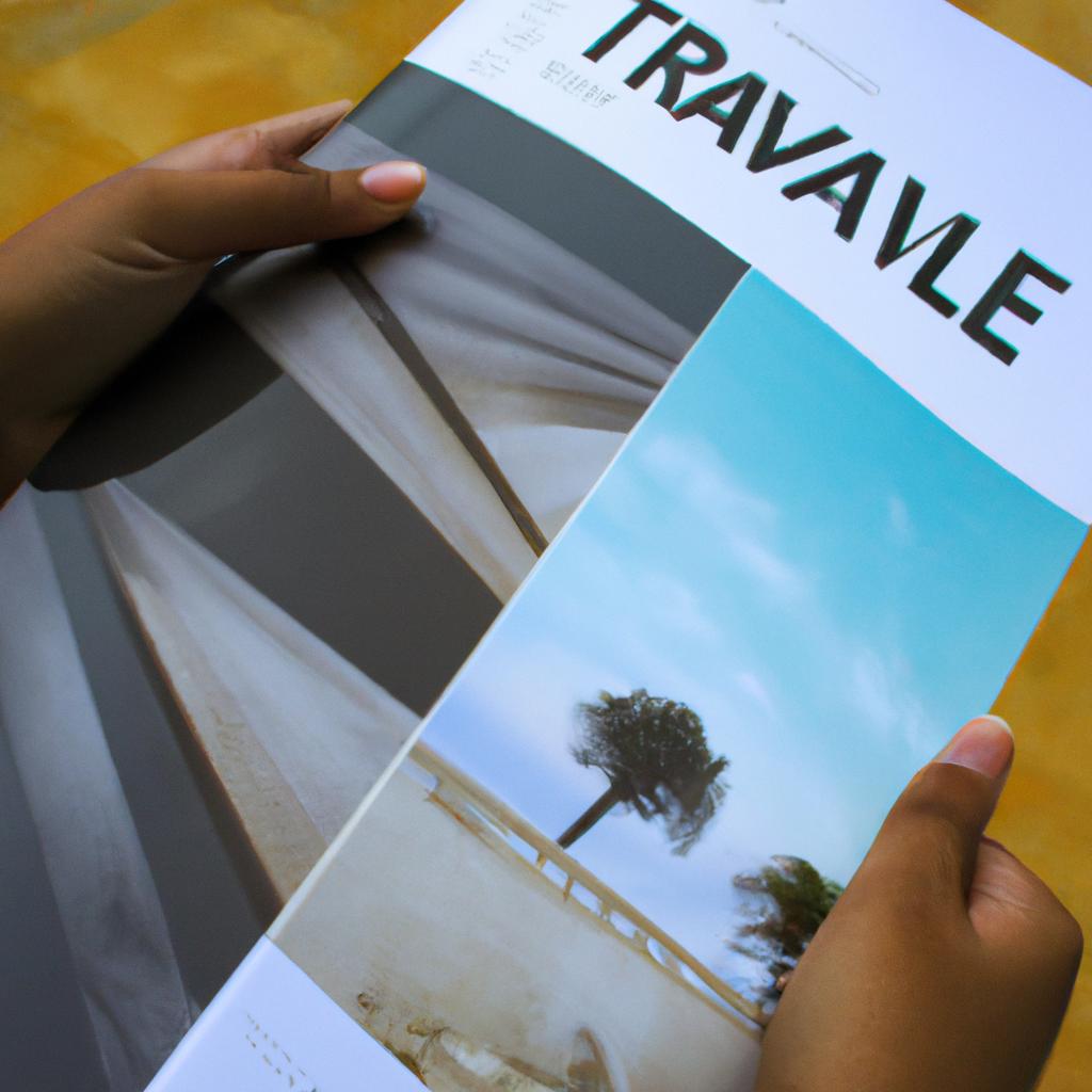 Person holding a travel brochure
